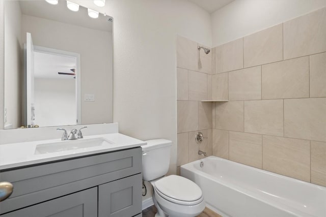 bathroom with vanity, shower / tub combination, and toilet