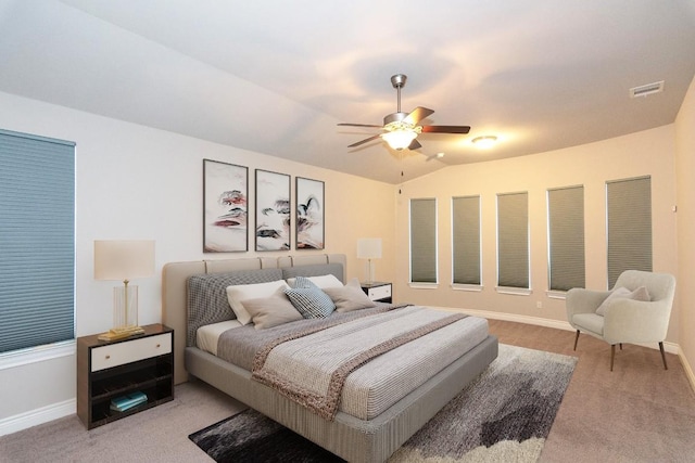 carpeted bedroom with ceiling fan and lofted ceiling