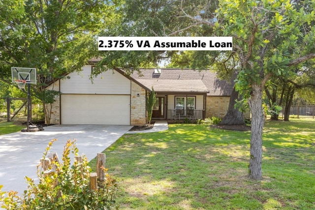 view of front facade featuring a garage, covered porch, and a front yard