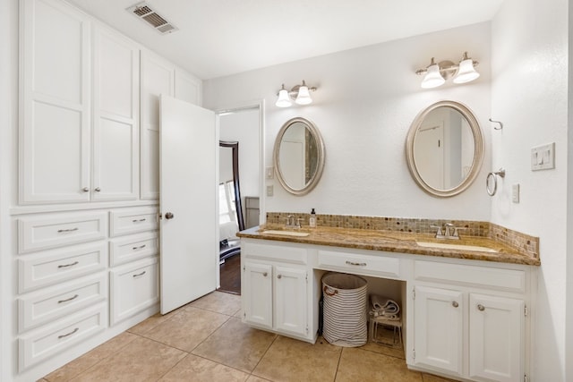 bathroom featuring vanity and tile patterned flooring