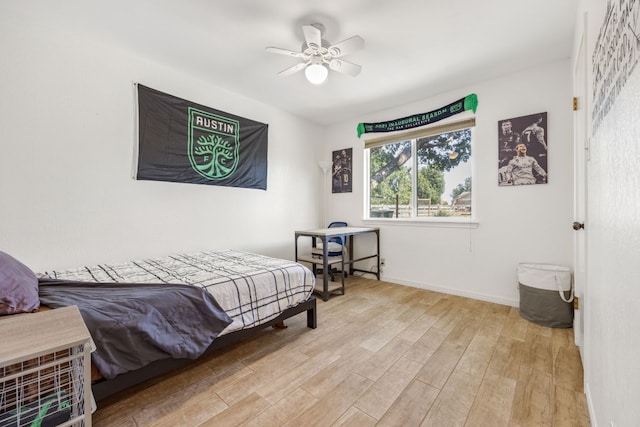 bedroom featuring ceiling fan and light wood-type flooring