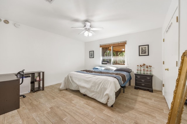 bedroom featuring ceiling fan and light wood-type flooring