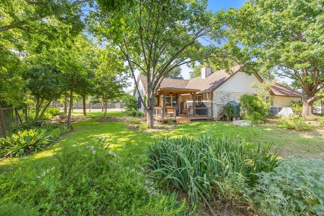 view of yard featuring a wooden deck