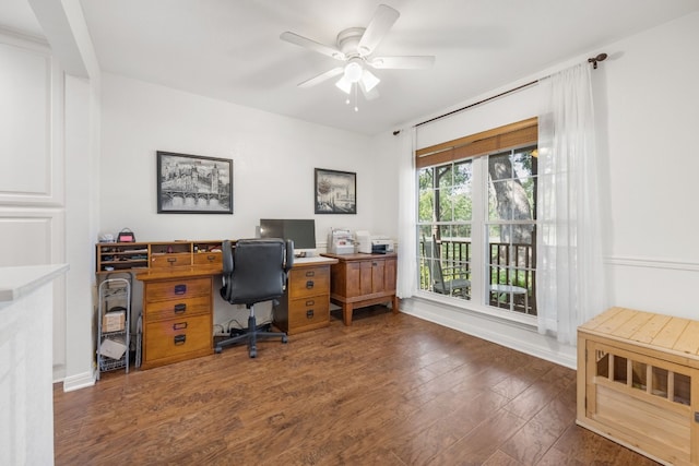 office featuring dark hardwood / wood-style floors and ceiling fan