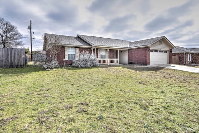 single story home featuring a garage, a porch, and a front lawn