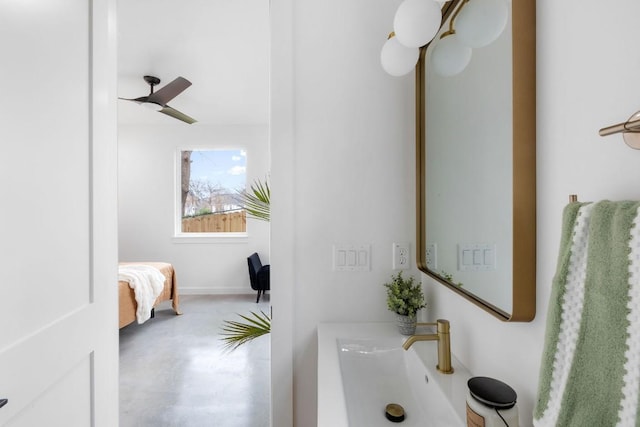 bathroom featuring ceiling fan and concrete floors