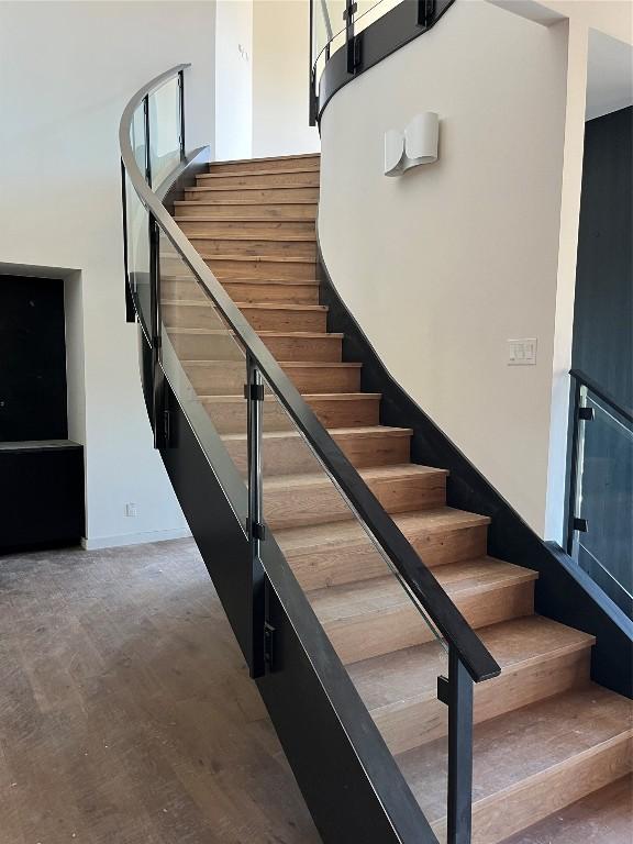 staircase with wood-type flooring