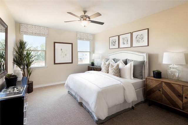 bedroom with multiple windows, carpet floors, and ceiling fan