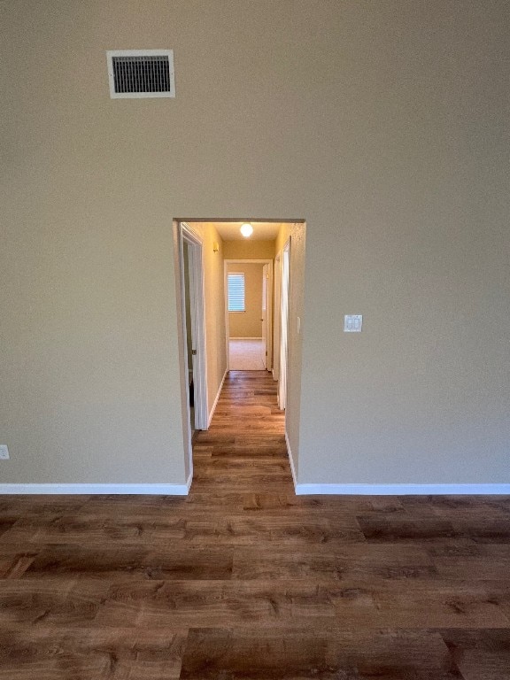 corridor with dark wood-type flooring