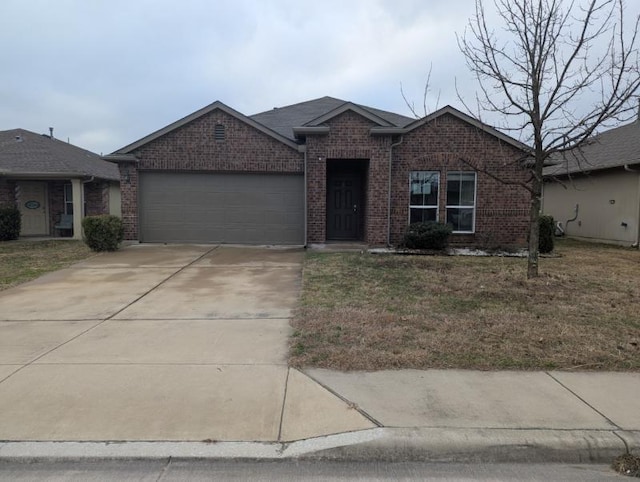 ranch-style home featuring a garage and a front yard