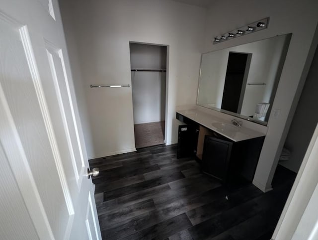 bathroom with vanity and hardwood / wood-style floors