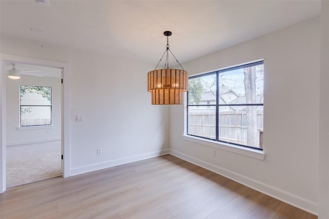 unfurnished room with light hardwood / wood-style floors and a wealth of natural light