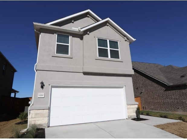 view of front of home featuring a garage