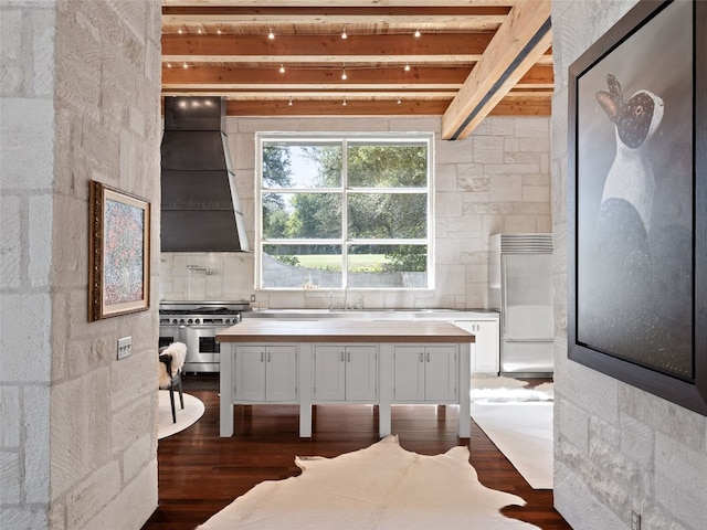 bathroom featuring beamed ceiling, tasteful backsplash, and hardwood / wood-style flooring