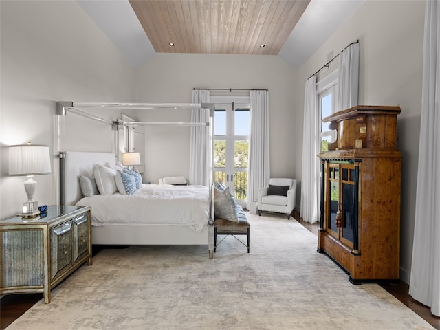 bedroom featuring vaulted ceiling and wooden ceiling