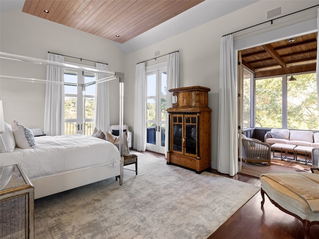 bedroom featuring lofted ceiling, access to outside, wooden ceiling, and french doors