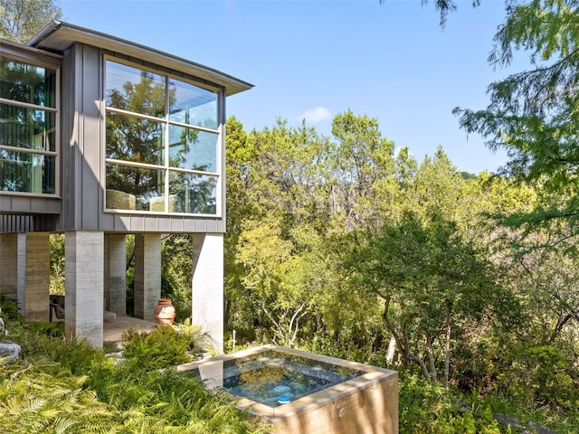 1200 Barton Creek Blvd Unit 35, Austin, TX 78735 - exterior view of a hot tub and board and batten siding