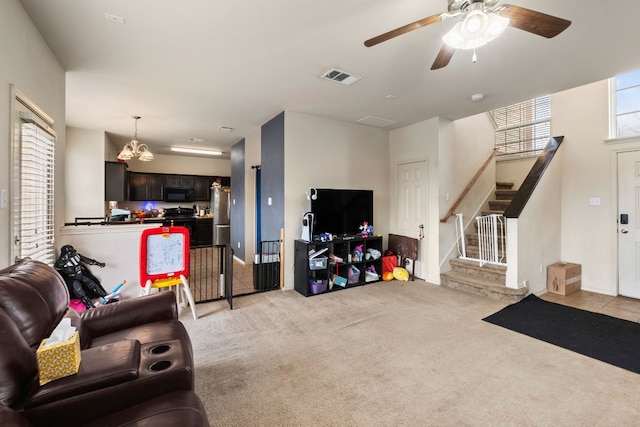 living room with light colored carpet and ceiling fan