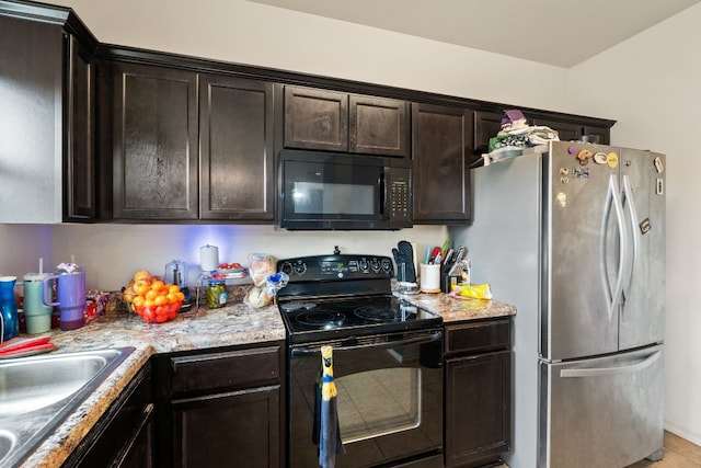 kitchen featuring dark brown cabinets, sink, and black appliances