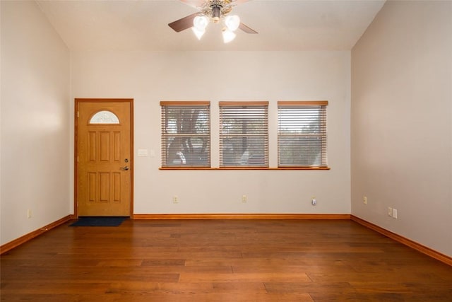 foyer entrance featuring dark wood-type flooring and ceiling fan