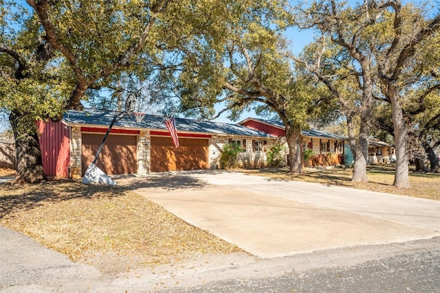 ranch-style home featuring a garage