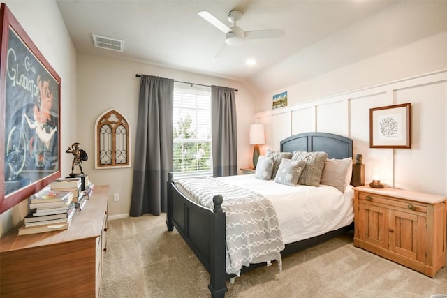 carpeted bedroom with ceiling fan and lofted ceiling