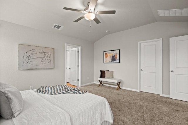 bedroom with ceiling fan, lofted ceiling, and carpet