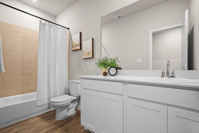 full bathroom featuring wood-type flooring, toilet, vanity, and shower / tub combo with curtain