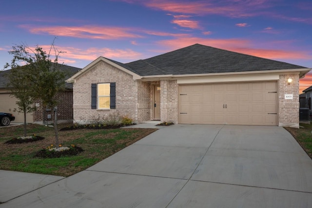 single story home with a garage