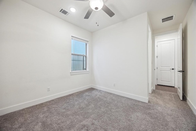 carpeted empty room featuring ceiling fan