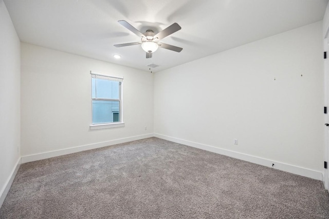 unfurnished room with ceiling fan and carpet flooring