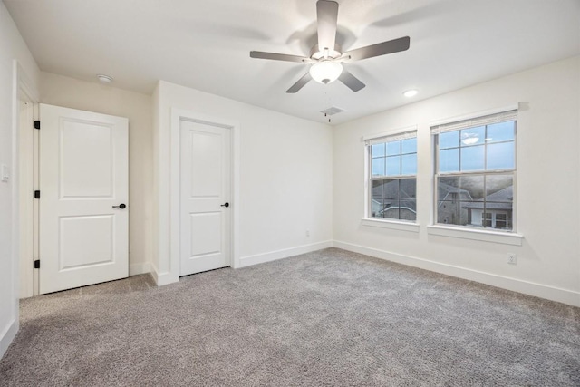 unfurnished bedroom with carpet floors and ceiling fan