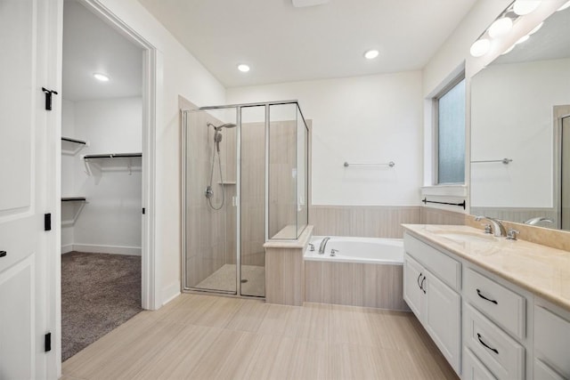 bathroom with vanity and plus walk in shower