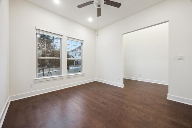 unfurnished room featuring ceiling fan and dark hardwood / wood-style flooring