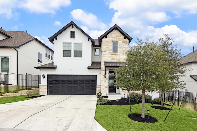 1220 Brassano Pl, Leander, TX 78641 - french country home with stone siding, concrete driveway, a garage, and stucco siding