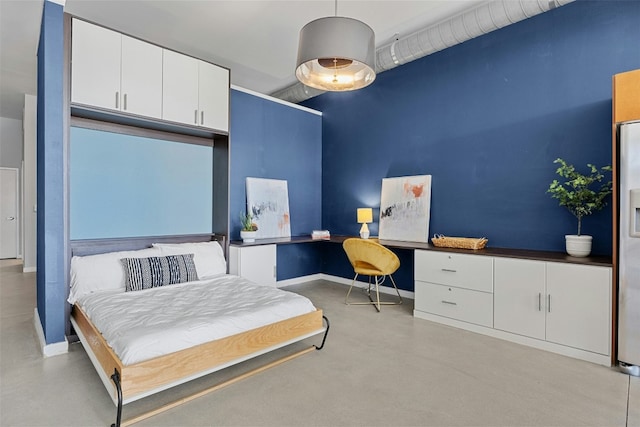 bedroom with concrete flooring, built in desk, stainless steel fridge with ice dispenser, and baseboards