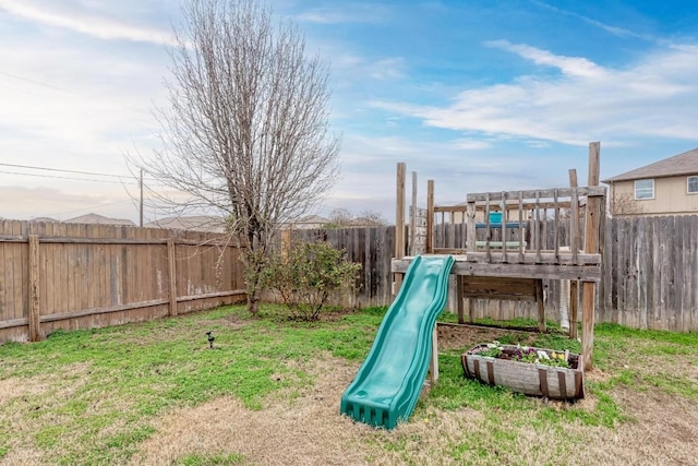 view of play area featuring a lawn