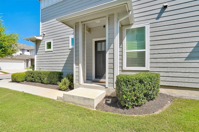 1801 Roseburg Dr Unit 29, Austin, TX 78754 - doorway to property featuring a garage and a yard