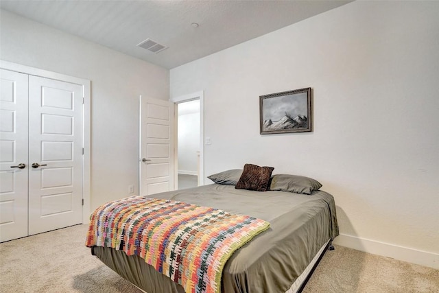 1801 Roseburg Dr Unit 29, Austin, TX 78754 - bedroom featuring light colored carpet and a closet
