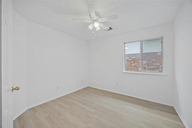 unfurnished room with ceiling fan and light hardwood / wood-style floors