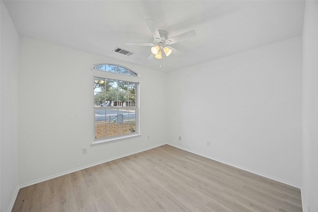 unfurnished room with light hardwood / wood-style flooring and ceiling fan