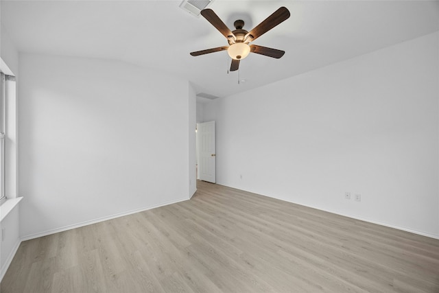 empty room with ceiling fan and light hardwood / wood-style floors