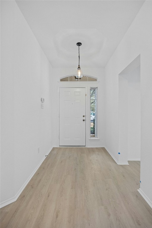 foyer entrance with light hardwood / wood-style flooring