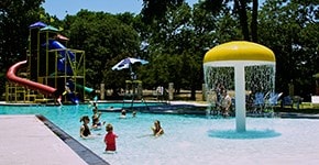 view of pool featuring a playground and a water slide