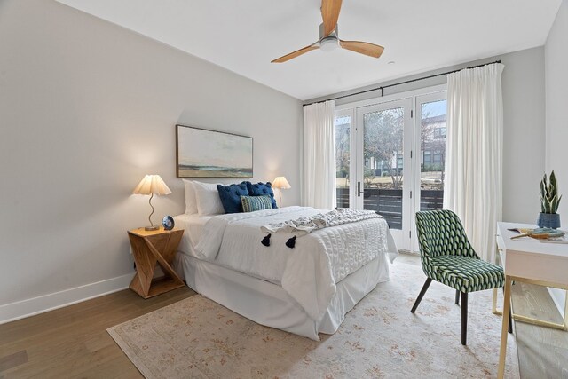 bedroom featuring ceiling fan, hardwood / wood-style floors, and access to outside