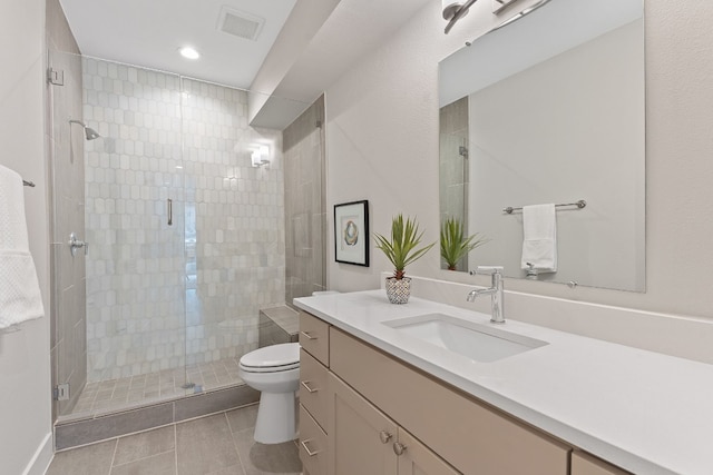 4510 Unity Cir Unit 258, Austin, TX 78731 - bathroom with vanity, toilet, a shower stall, tile patterned floors, and recessed lighting