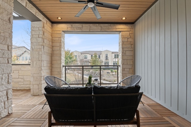 sunroom / solarium with wooden ceiling and ceiling fan