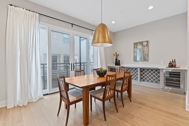 4510 Unity Cir Unit 258, Austin, TX 78731 - dining area with wine cooler, light wood-type flooring, recessed lighting, and a bar