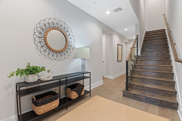 stairs with wood-type flooring