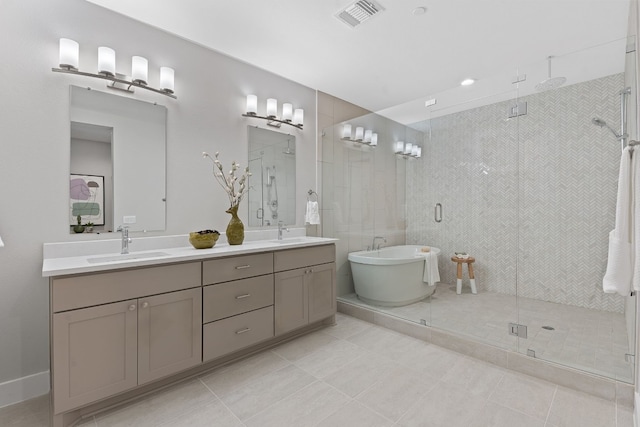 bathroom featuring vanity, tile patterned floors, and plus walk in shower